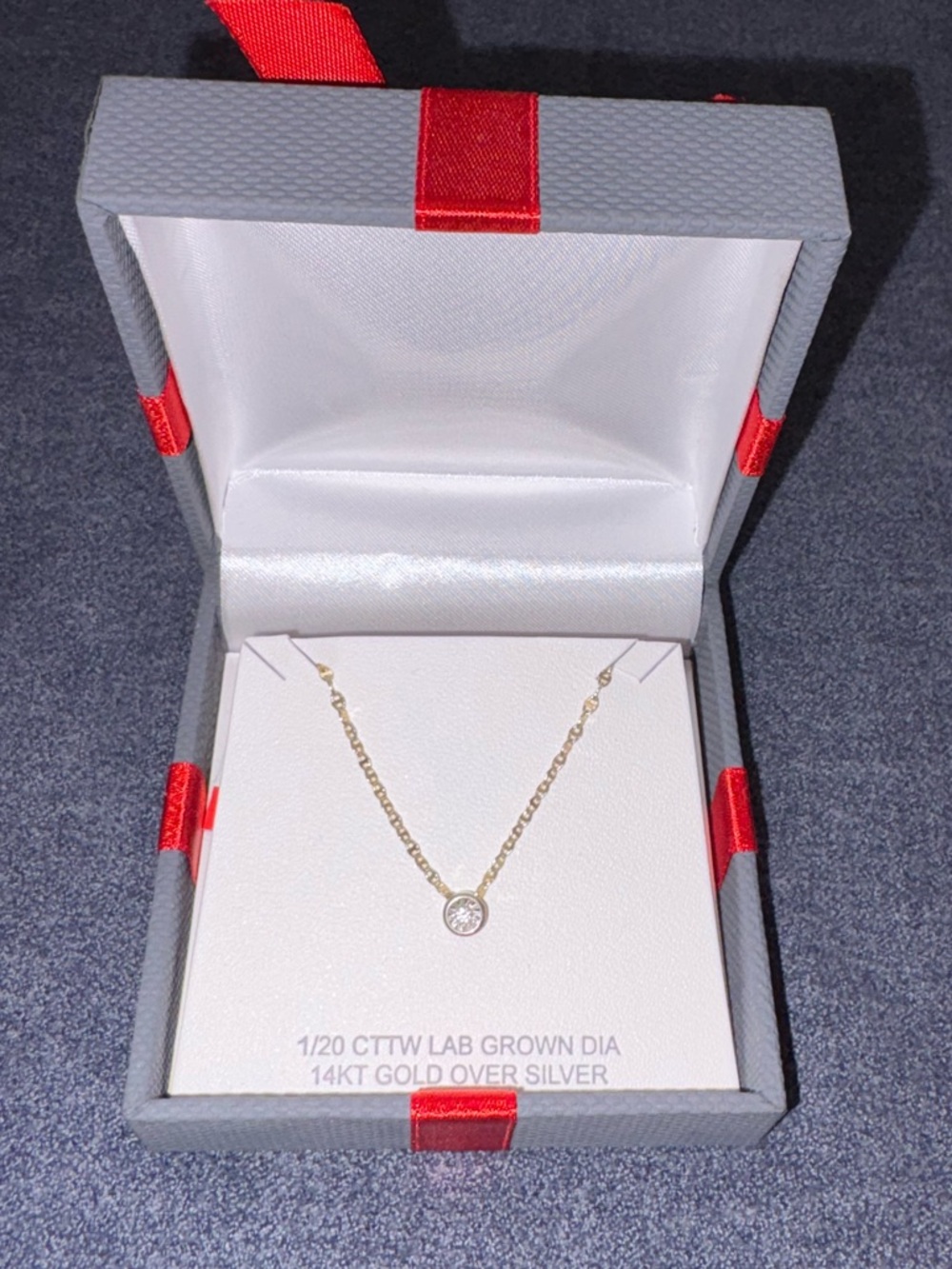 NIB 1/20 tcw lab grown diamond pendant
on 14kt yellow gold over silver 18"